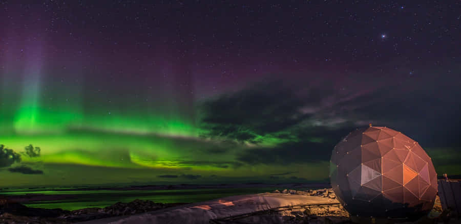 Stunning Southern Lights Over Mountains Wallpaper