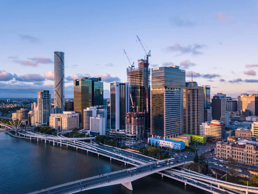 Stunning Sunset Over Brisbane Skyline Wallpaper