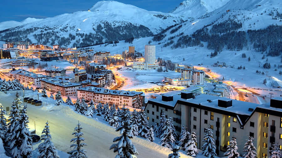 Stunning View Of A Ski Resort At Twilight Wallpaper