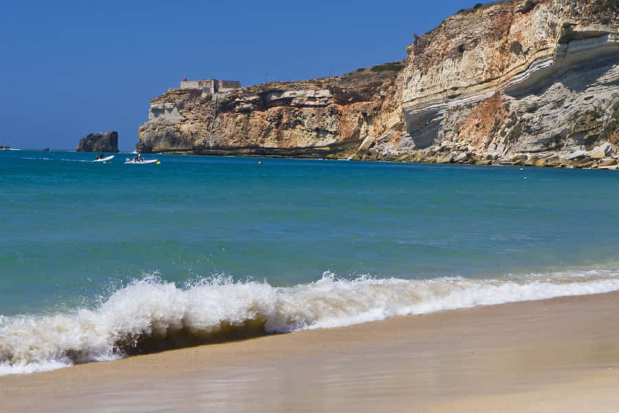 Stunning View Of The Beautiful Portuguese Beach Wallpaper