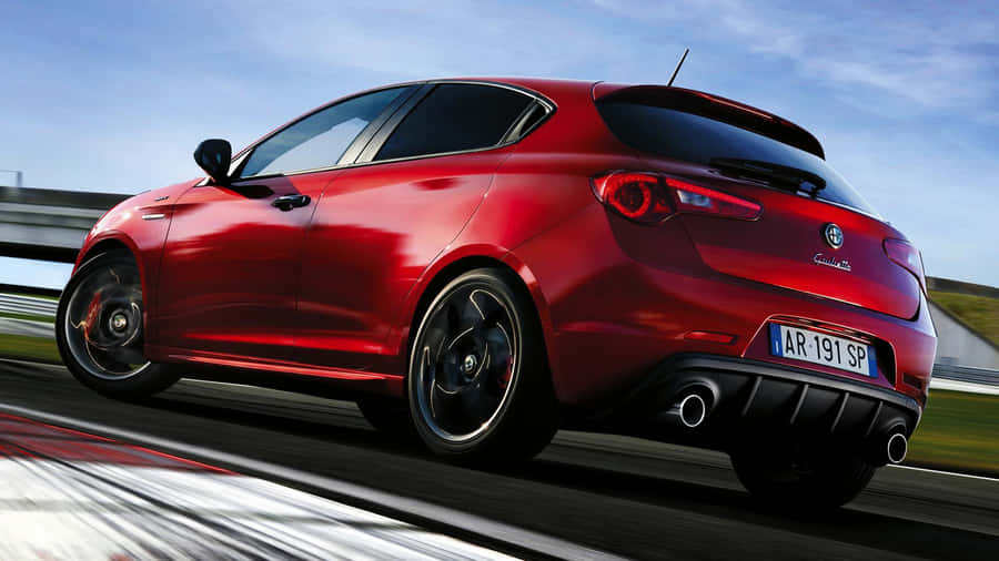 Stylish Alfa Romeo Giulietta On The Road Wallpaper