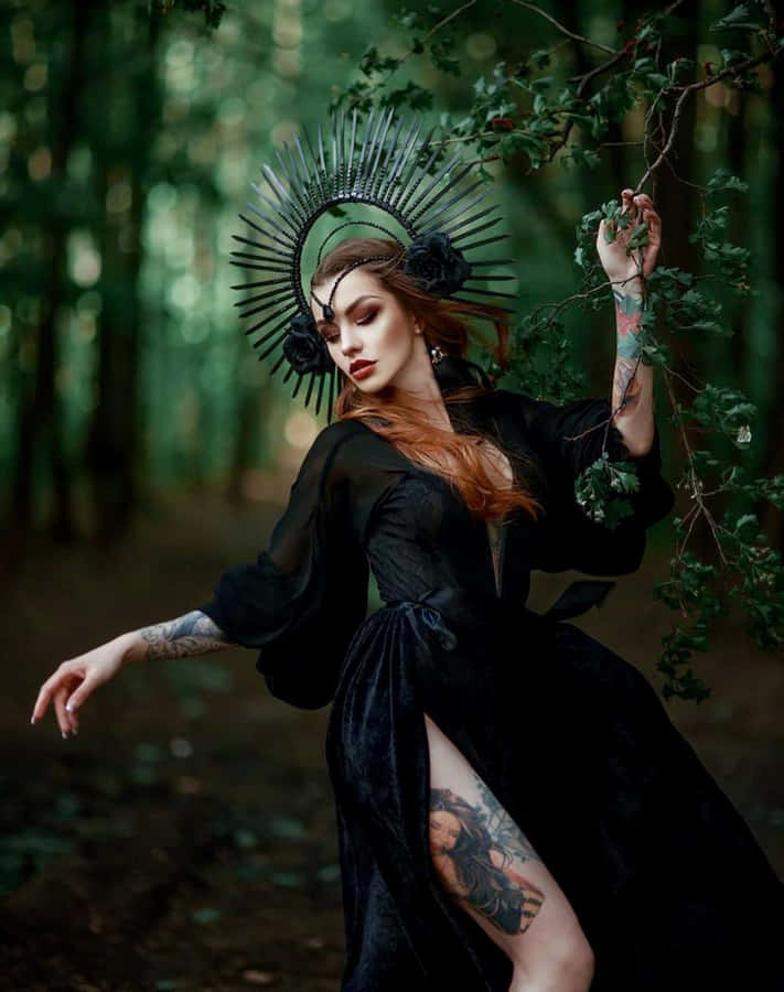 Stylish And Elegant Witch Costume In A Spooky Setting Wallpaper