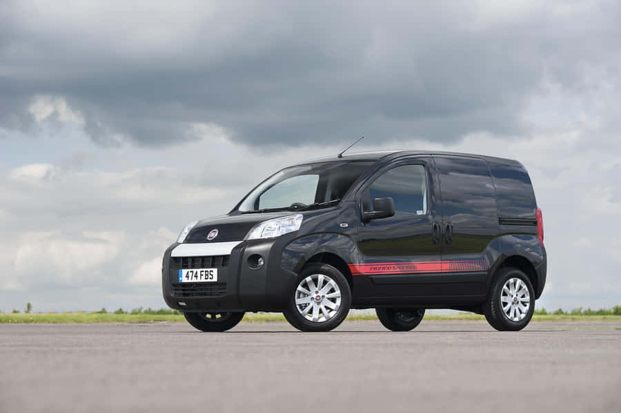 Stylish And Versatile Fiat Fiorino Van In Action Wallpaper