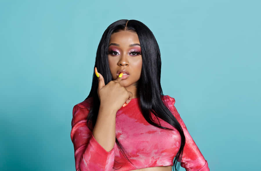 Stylish Artistin Red Topand Bold Makeup Wallpaper