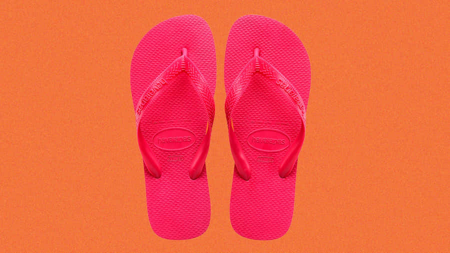 Stylish Beach Sandals On The Perfect Sandy Shore Wallpaper