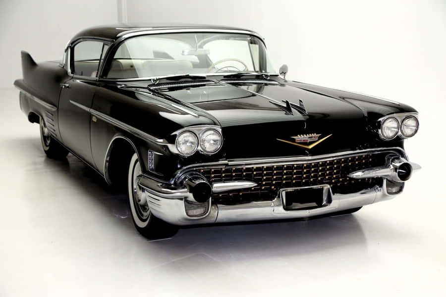 Stylish Cadillac Deville Cruising The Streets Wallpaper