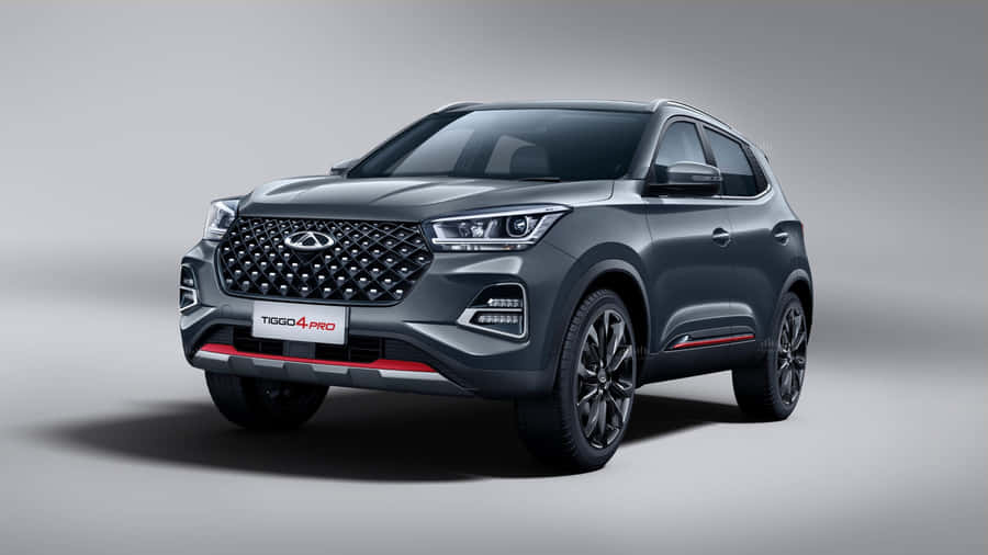 Stylish Chery Car In Vibrant Setting Wallpaper