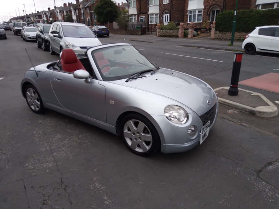 Stylish Daihatsu Copen On A Scenic Route Wallpaper