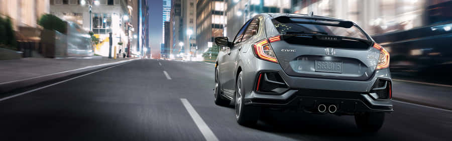 Stylish Hatchback Car On Display Wallpaper