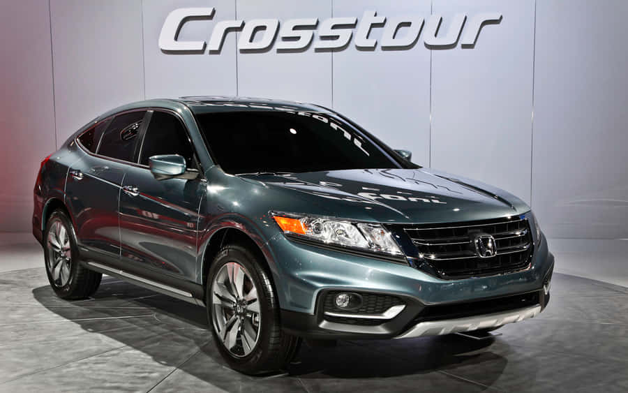 Stylish Honda Crosstour Driving On A Scenic Road Wallpaper