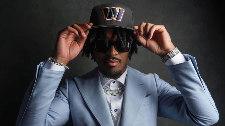 Stylish Man Holding Cap Wallpaper