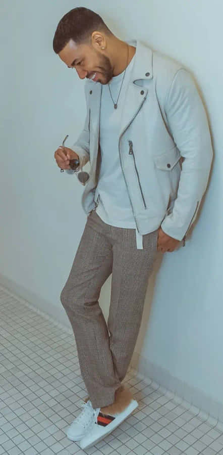 Stylish Man Leaning Against Wall Wallpaper