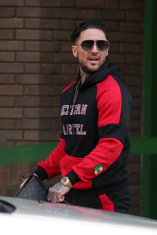 Stylish Manin Red Black Hoodieand Sunglasses Wallpaper