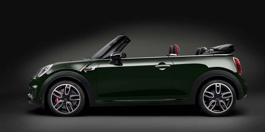 Stylish Mini Cooper Convertible Cruising The City Wallpaper