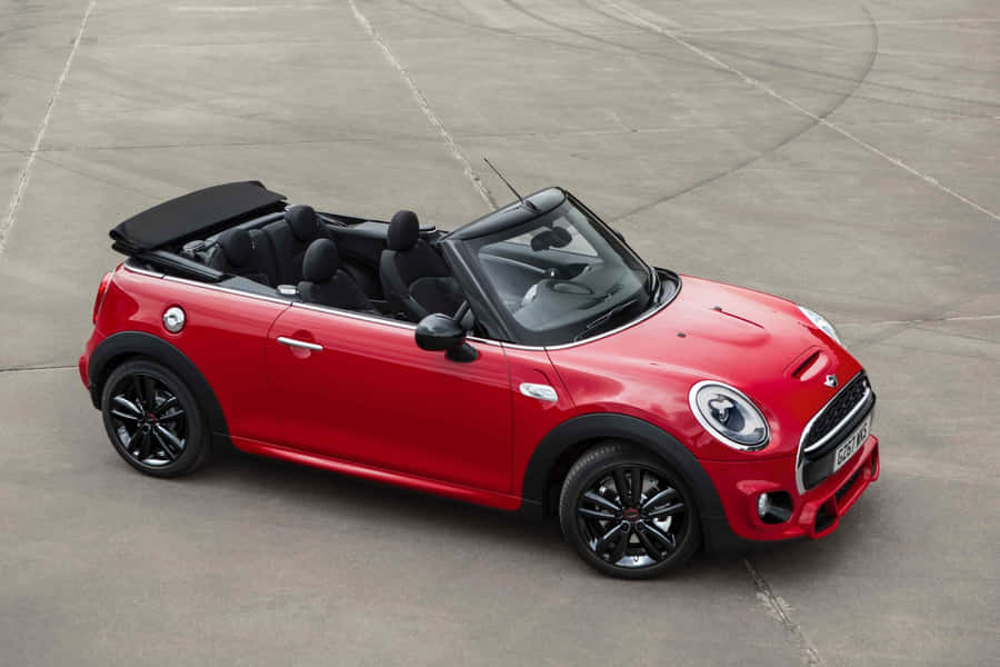 Stylish Mini Cooper S Convertible On Open Road Wallpaper
