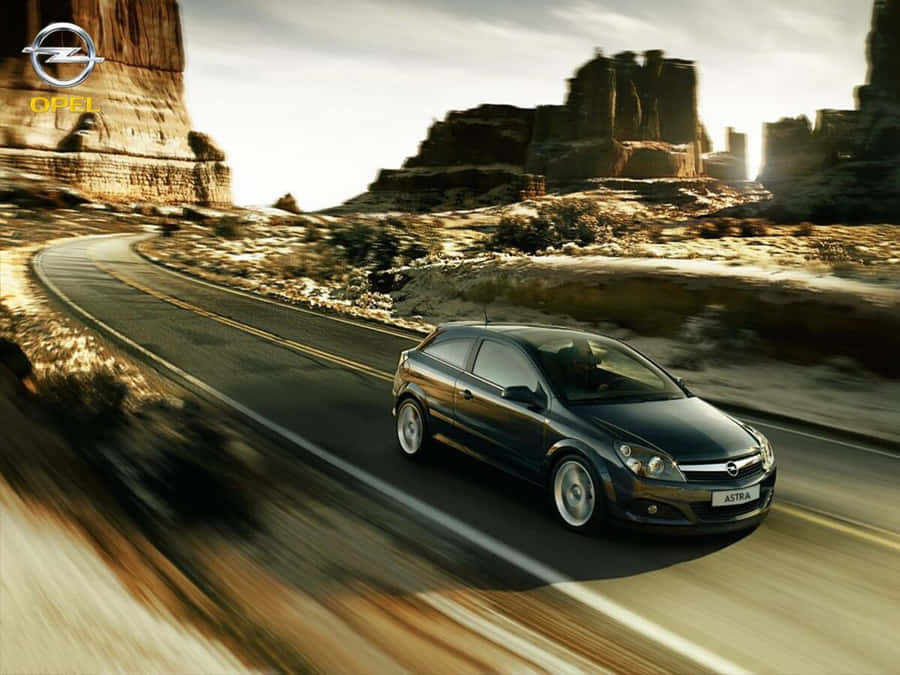 Stylish Opel Astra Sports Hatchback On A Scenic Drive Wallpaper