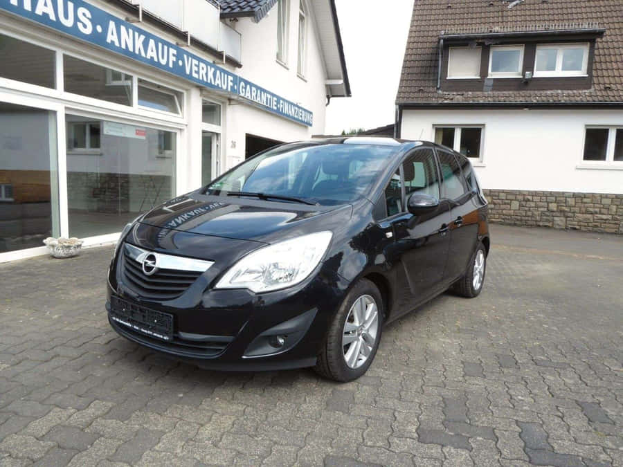 Stylish Opel Meriva In Urban Setting Wallpaper