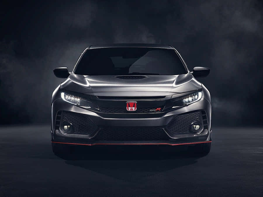 Stylish Red Hatchback On City Street Wallpaper