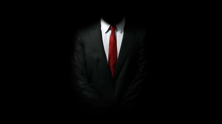 Stylish Red Tie On Dark Suit Wallpaper