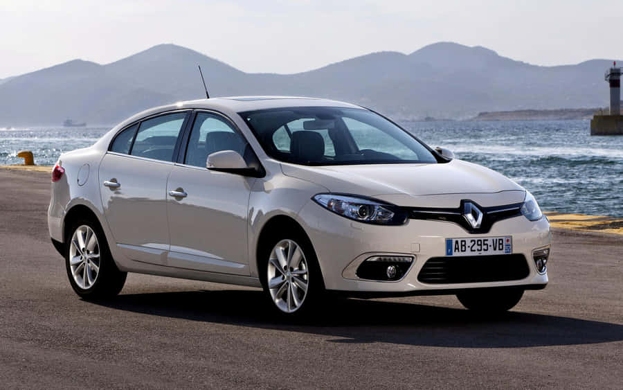 Stylish Renault Fluence Cruising On The Road Wallpaper