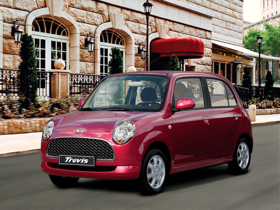 Stylish Silver Daihatsu Trevis On A Bustling City Street. Wallpaper