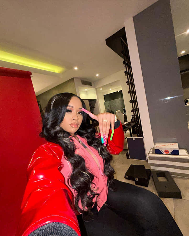 Stylish Woman Red Jacket Posing Indoors Wallpaper