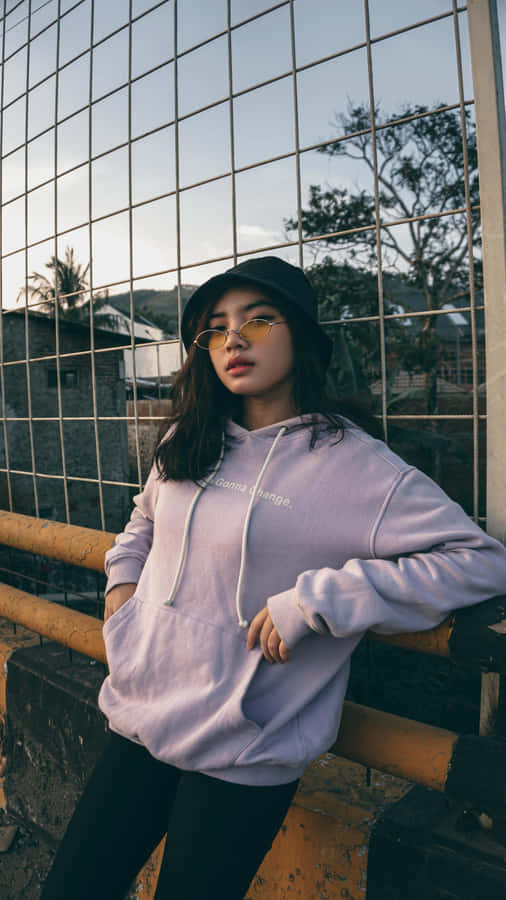 Stylish Womanin Purple Hoodieand Black Beret Wallpaper