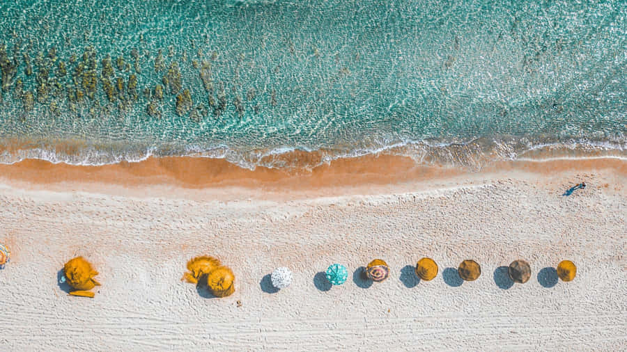 Summer Beach Aerial Viewwith Colorful Umbrellas Wallpaper