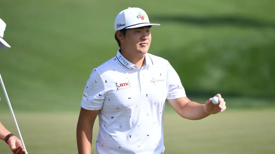 Sungjae Im Smiling And Holding A Ball Wallpaper