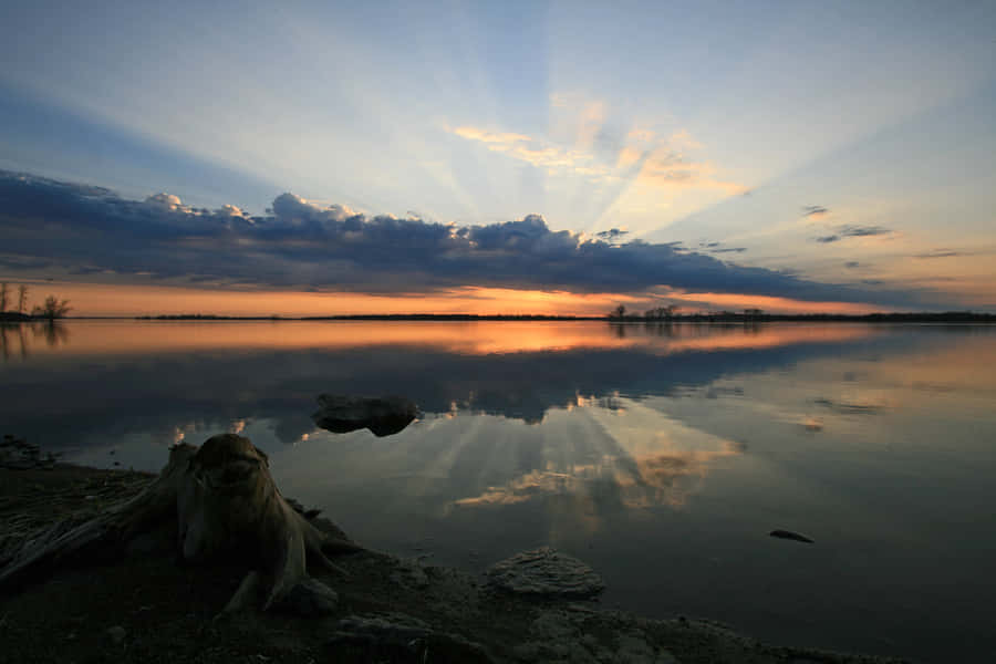 Sunset Over A Primordial River Wallpaper