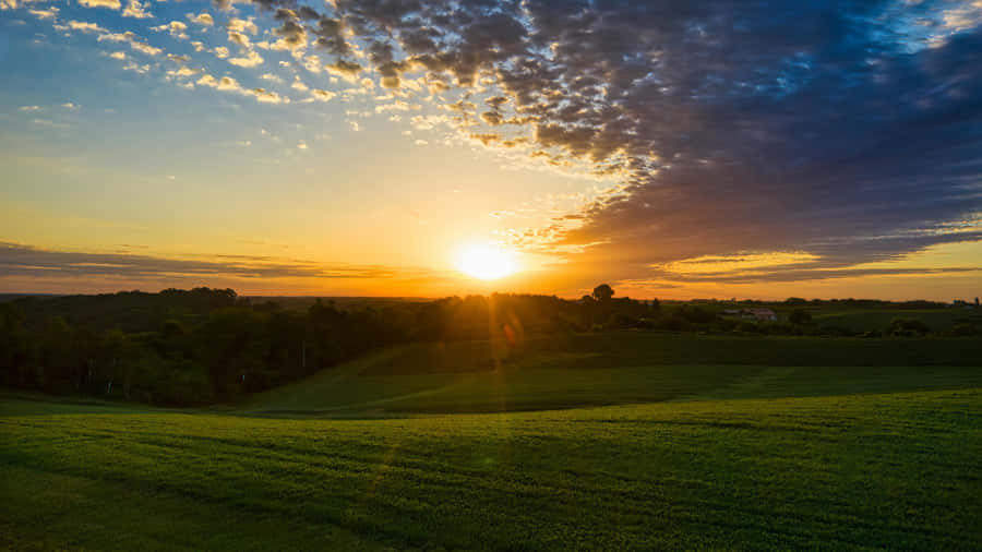 Sunset Over Rolling Farmland Wallpaper