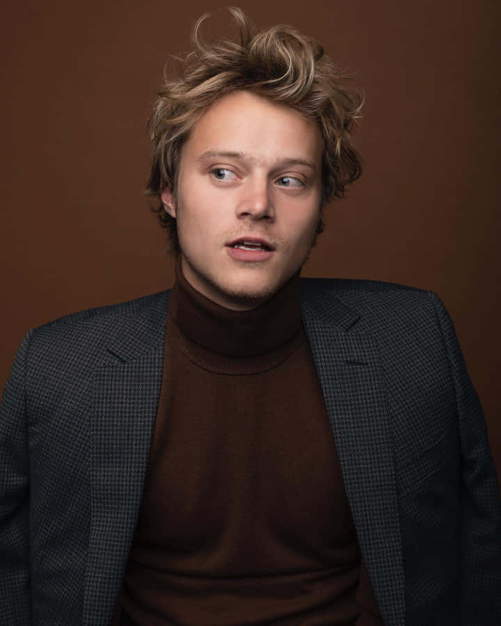 Surprised Manin Turtleneckand Blazer Wallpaper