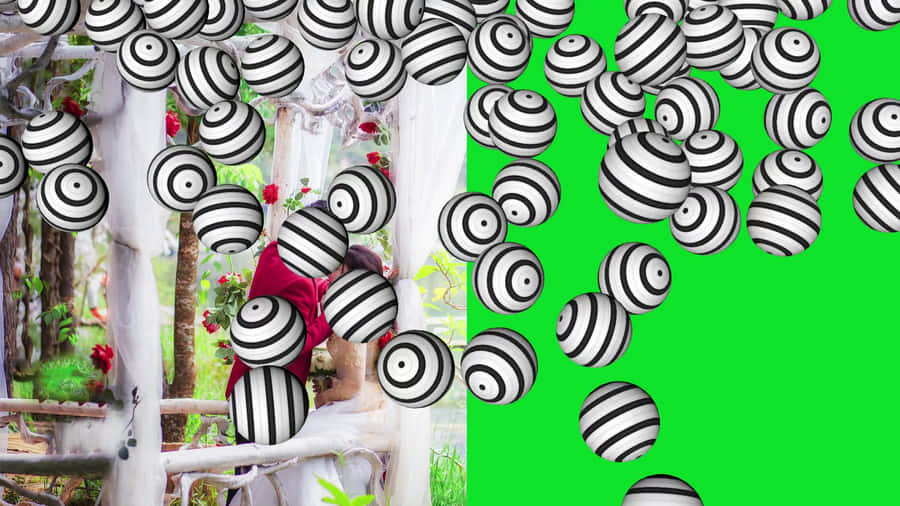 Surreal Wedding Framewith Striped Spheres Wallpaper