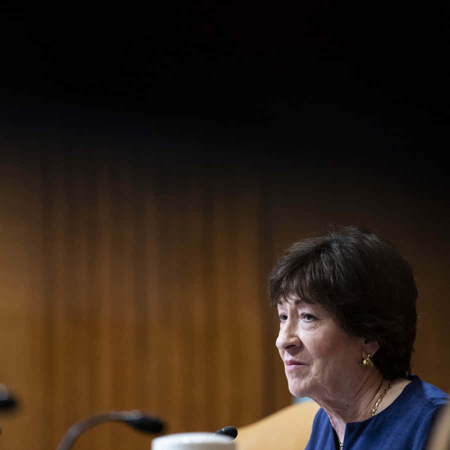 Susan Collins Speaking On The Phone Wallpaper