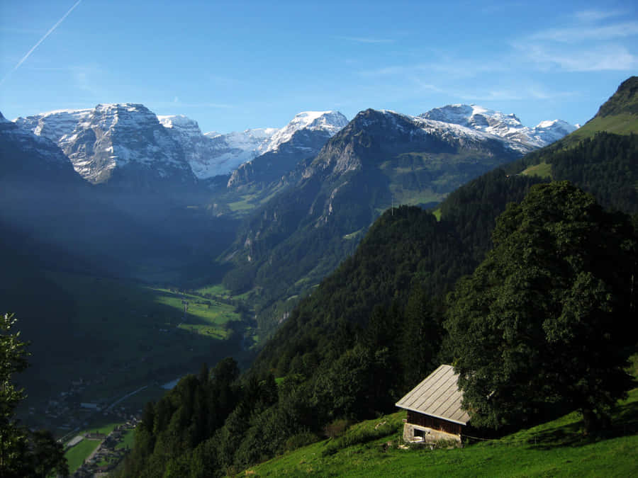 Sweeping Panoramic View Of Glarus Valley Wallpaper