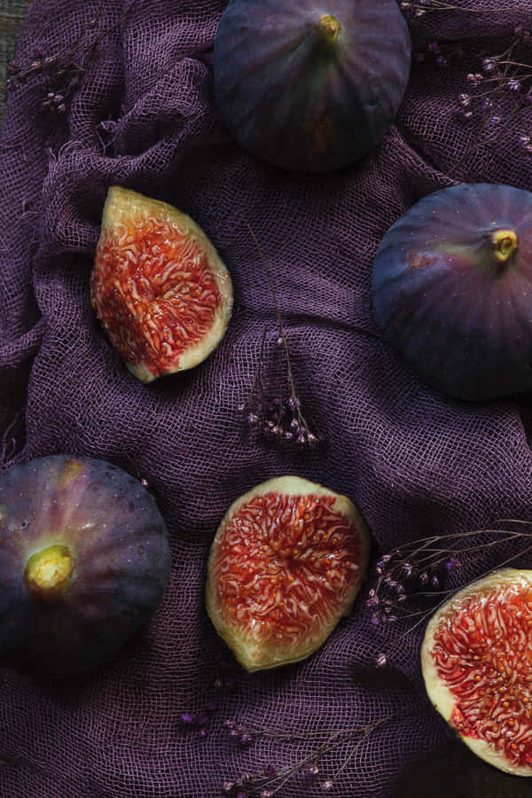 Sweet And Delicious Purple Figs, Perfect For A Healthy Snack. Wallpaper