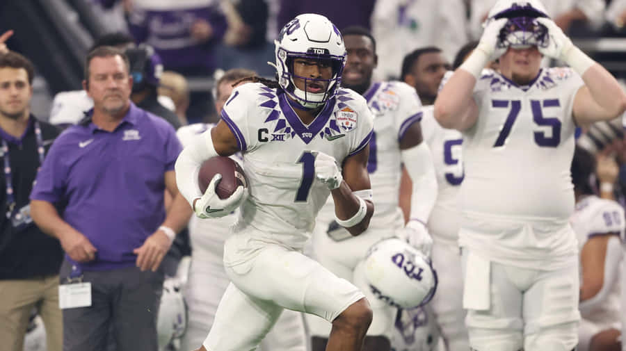T C U Football Player Action Shot Wallpaper