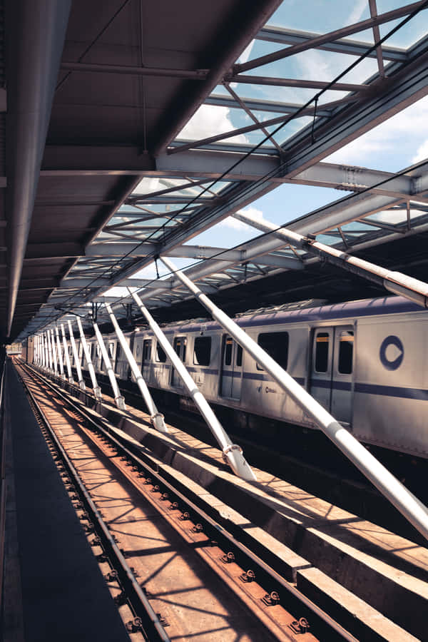 Taking A Train Ride Through The Bustling City Wallpaper
