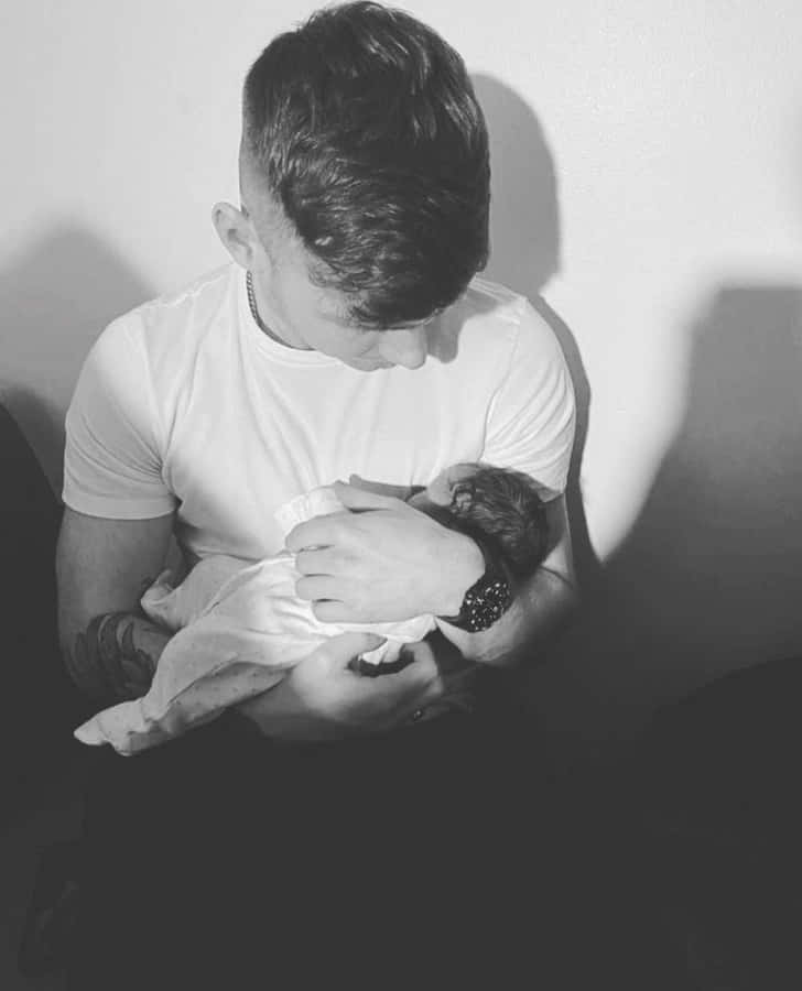 Tender Moment Fatherand Newborn Baby Wallpaper