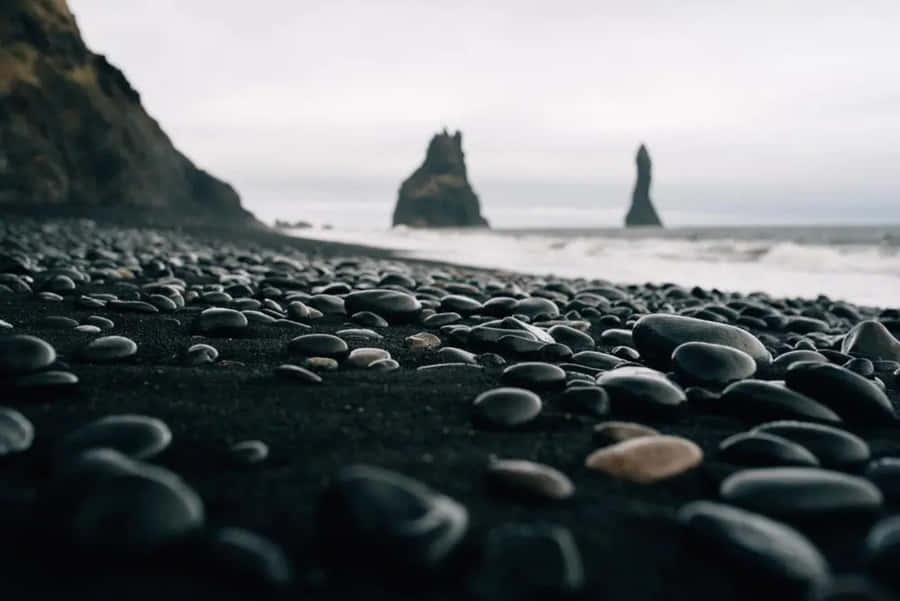 The Beauty Of A Black Sand Beach In The Mediterranean Wallpaper