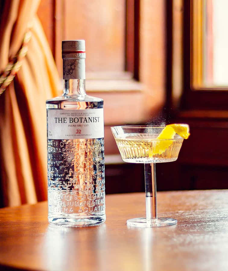 The Botanist Gin Alcoholic Drink On Table By The Window Wallpaper