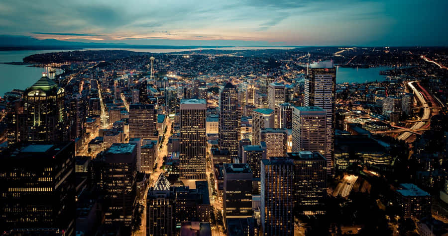 The Emerald City Glows: Seattle At Night Wallpaper
