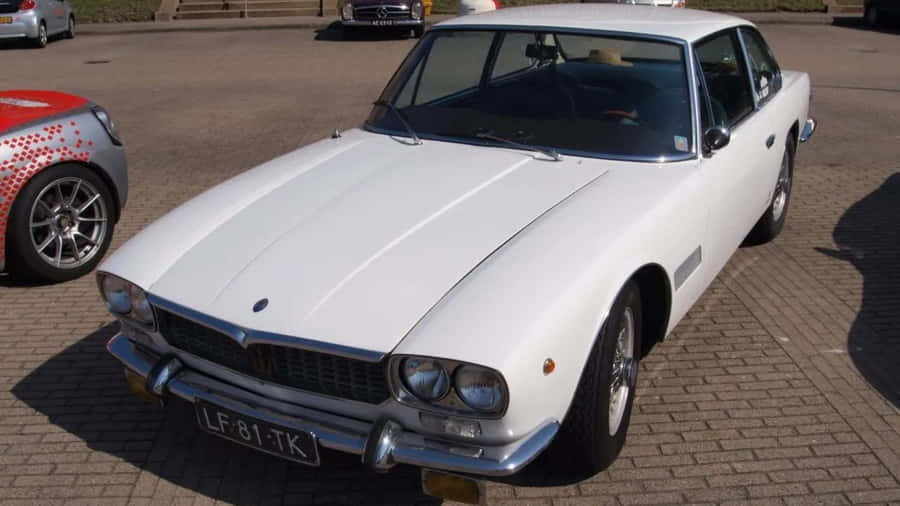 The Epitome Of Italian Luxury - A Majestic Maserati On Mexico Streets Wallpaper