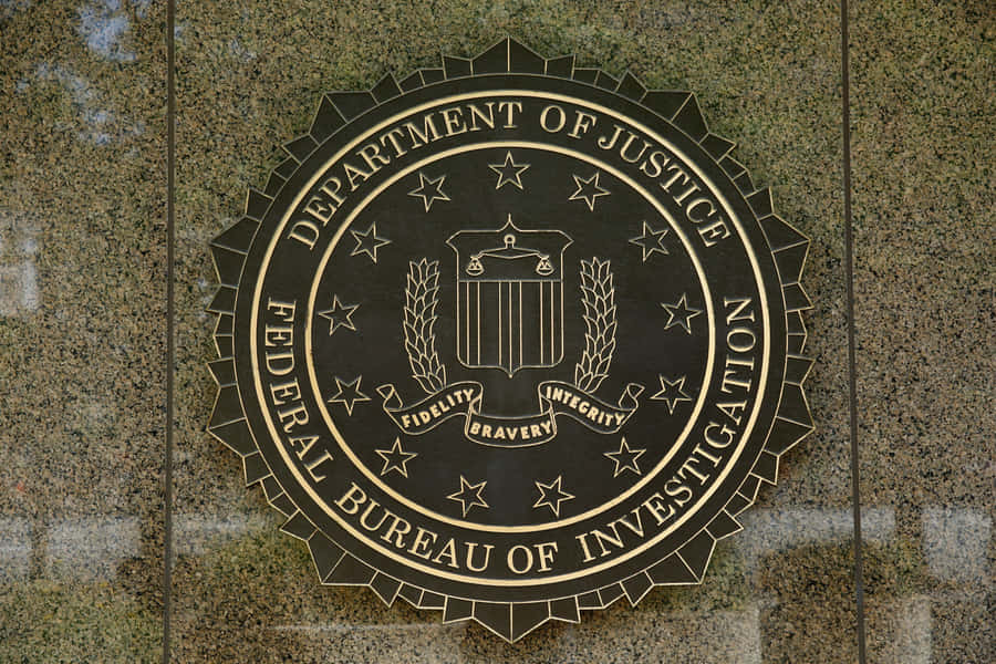 The Fbi Logo Is On The Wall Of A Building Wallpaper