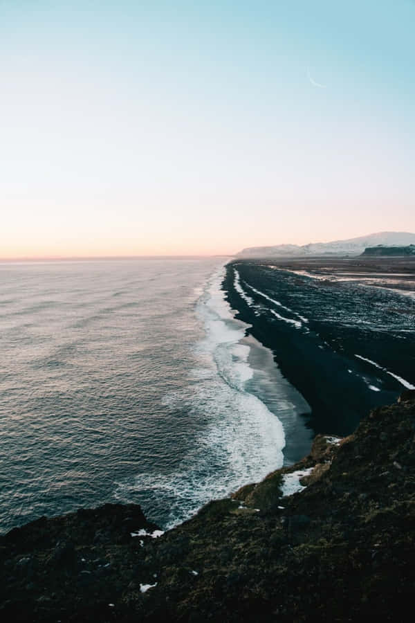 The Iconic Beauty Of Black Sand Beach Wallpaper