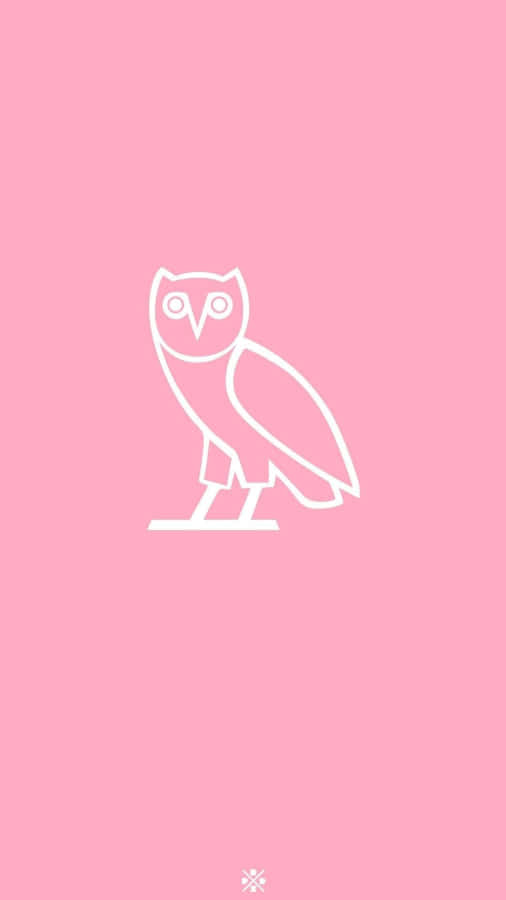 The Iconic Drake Ovo Owl Lights Up On An Apple Iphone 8. Wallpaper