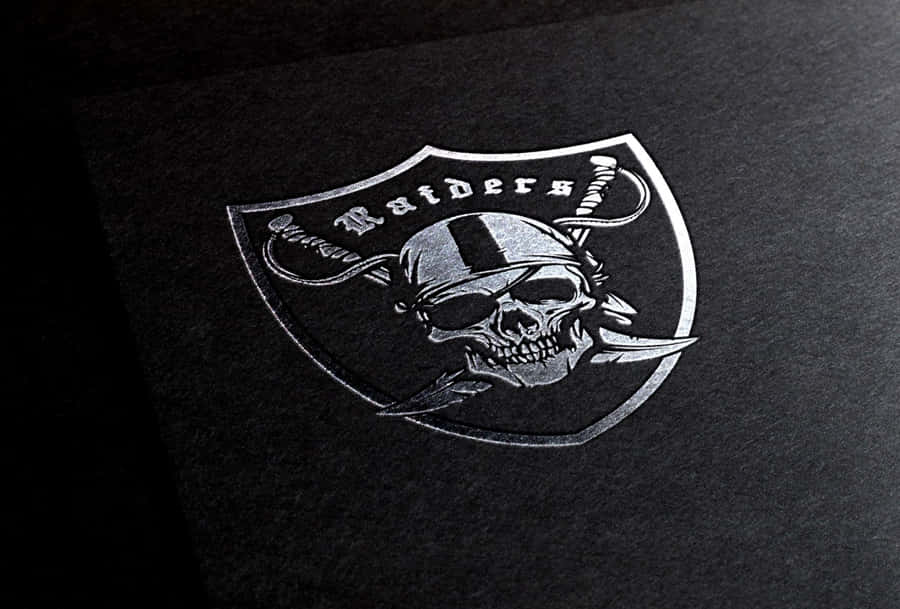 The Iconic Silver And Black Raiders Logo Wallpaper