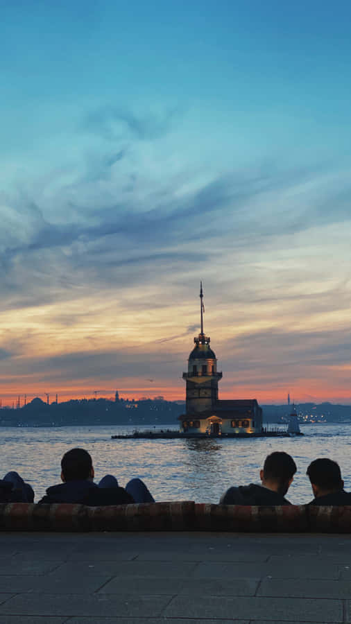 The Majestic Maiden Tower Against An Azure Sky Wallpaper