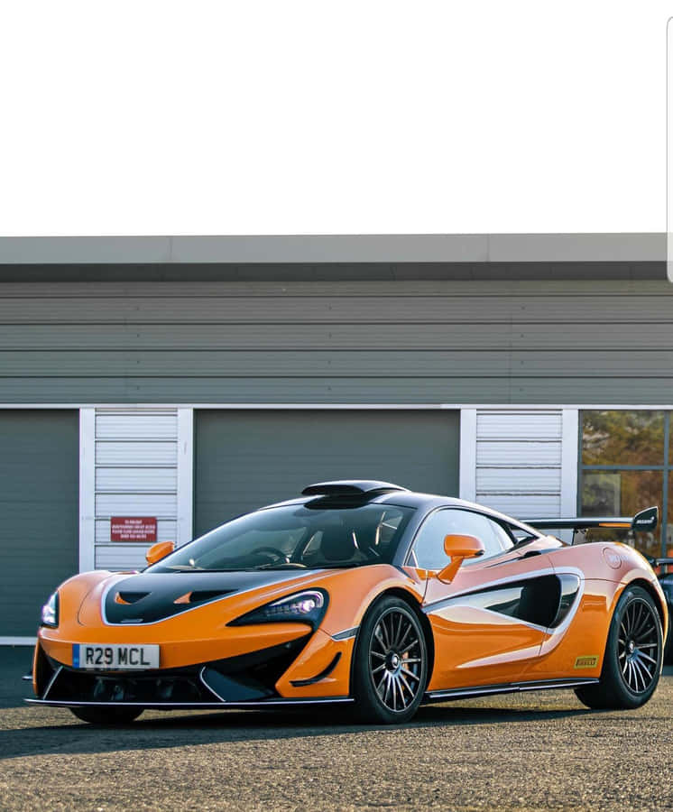 The Mclaren 620r Posing On The Race Track Wallpaper