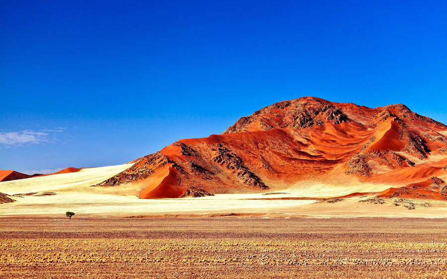 The Stunning View Of A Red Desert Mountain Wallpaper